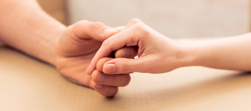Two people holding hands